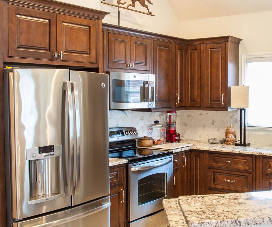 New installed wood cabinets with a walnut stain style.