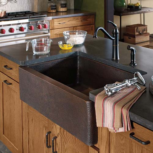 hammered brass sink and faucet is a modern twist on vintage style